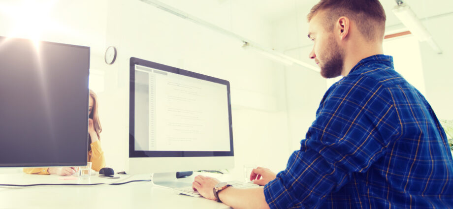 Young man using low code application platform