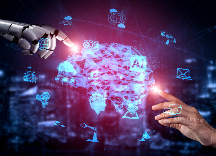 a robot hand and a human hand touching an computer animated brain